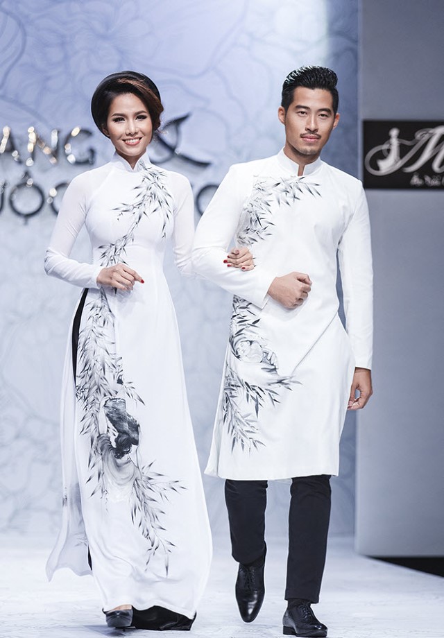 白いアオザイを着ているベトナム人女性とベトナム人男性